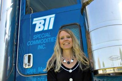 Photo of Vice President Teri Netusil in front of a BTI truck.